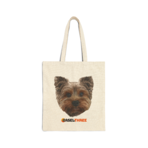 Front of a canvas tote featuring an image of a Yorkie and EaselThree's logo.