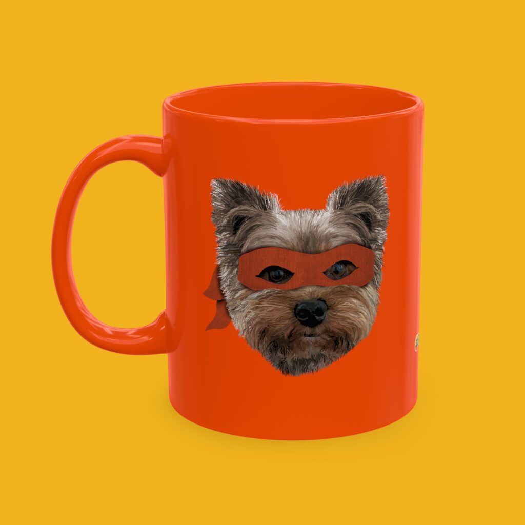 Orange coffee mug featuring a hand drawn image of our Yorkie BFF wearing a purple ninja mask.