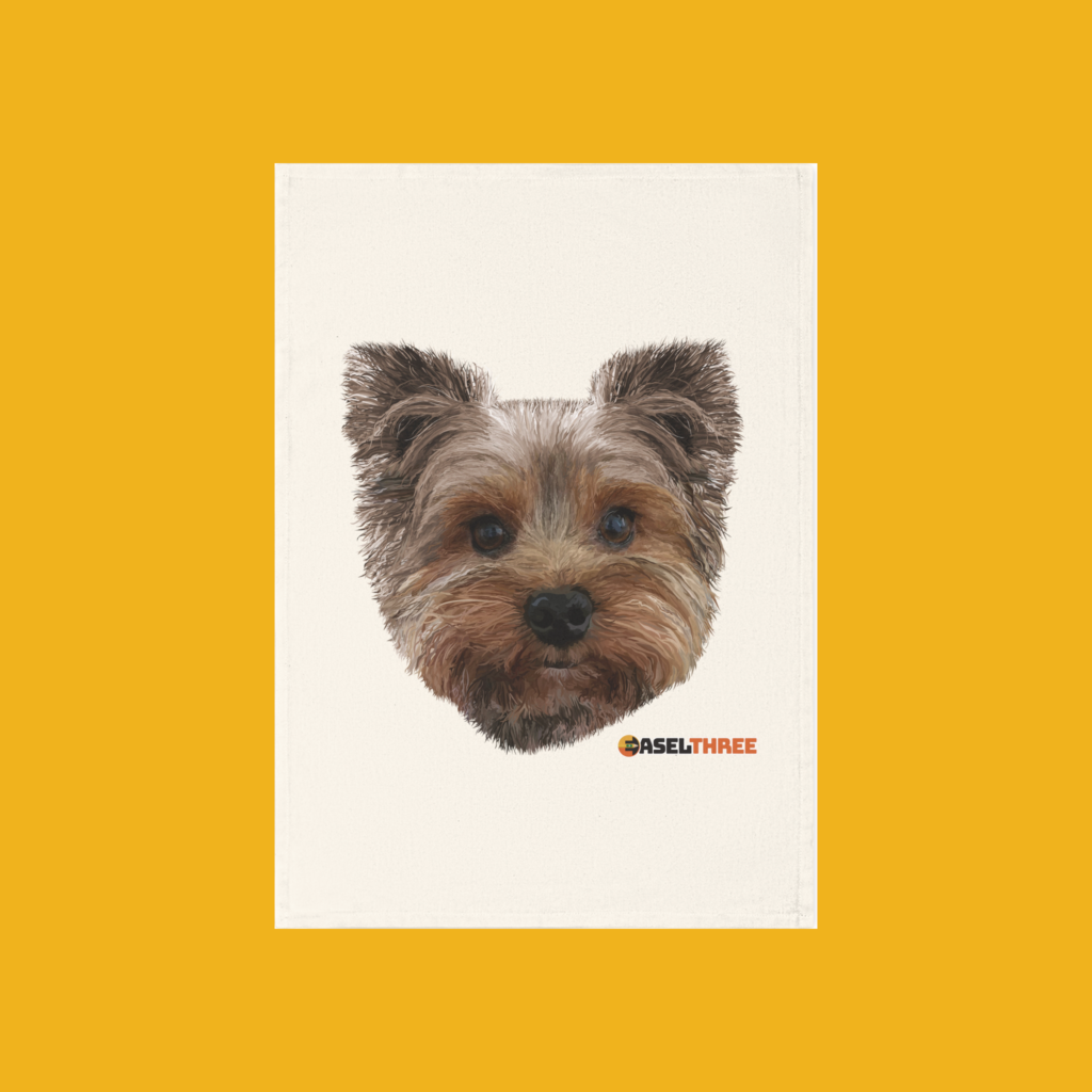 Natural colored cotton tea towel featuring a hand drawn image of a Yorkshire Terrier.